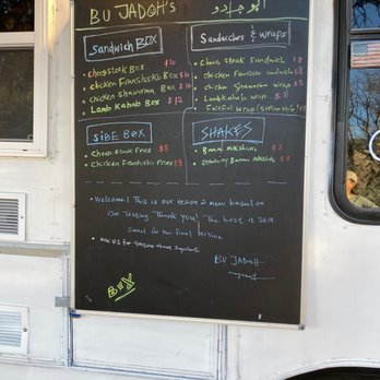 Bu Jadoh - a menu on the side of a food truck - Syrian Near Me - Austin, Texas