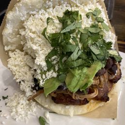 Pabellon-- shredded Beef, black beans, sweet plantains, cheese. Added avocado.