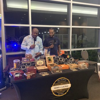 The Cigar Box - two men at a table with cigars - Cigar Bars Near Me - Spring, Texas The Cigar Box - two men at a table with cigars - Cigar Bars Near Me - Spring, Texas