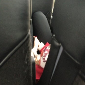 BoltBus - Girl pinning herself against seat to sleep... But also cause these are hammocks :-( - Transportation Near Me - Washington, DC, District of Columbia