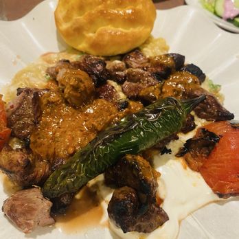 Saray Turkish Cuisine - Alinazik Kebab - Grilled lamb over sauced grilled eggplant and yogurt, served with salad and bread. - Turkish Near Me - Burnaby, British Columbia Saray Turkish Cuisine - Alinazik Kebab - Grilled lamb over sauced grilled eggplant and yogurt, served with salad and bread. - Turkish Near Me - Burnaby, British Columbia