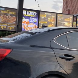 a car parked in front of a restaurant a car parked in front of a restaurant