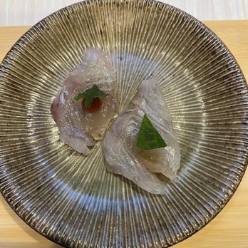Fins and Scales - a plate of food on a table - Kosher Near Me - New York, New York