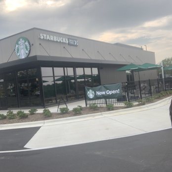 Starbucks - a man riding a skateboard in front of a starbucks - Coffee & Tea Near Me - Whitsett, North Carolina Starbucks - a man riding a skateboard in front of a starbucks - Coffee & Tea Near Me - Whitsett, North Carolina