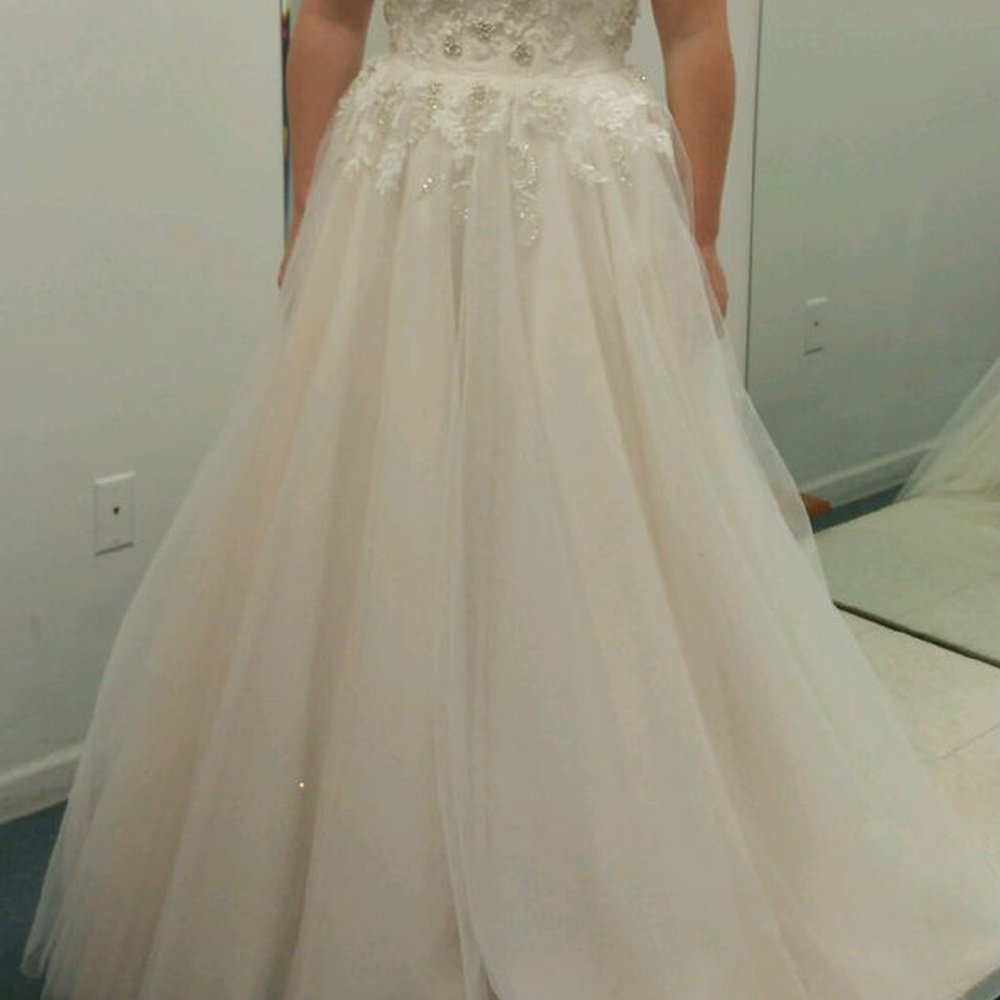 Before the hem was done on my wedding dress. At this point, And Sew On, had taken my dress in and it fit perfect! Before the hem was done on my wedding dress. At this point, And Sew On, had taken my dress in and it fit perfect!