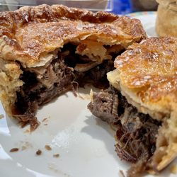 Oxtail and beef cheek pie opened