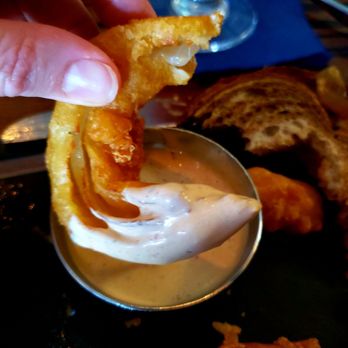 The Burger Local - Onion ring with tasty sauce - Burgers Near Me - Geneva, Illinois The Burger Local - Onion ring with tasty sauce - Burgers Near Me - Geneva, Illinois