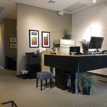 Joga Chiropractic Center - Front desk - people in hallway for size. - Chiropractors Near Me - Los Angeles, California