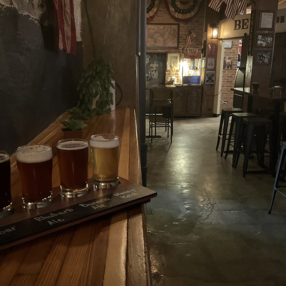 Rebellion Brewing - Inside the taproom with flight of 4. - Brewpubs Near Me - Cedarburg, Wisconsin Rebellion Brewing - Inside the taproom with flight of 4. - Brewpubs Near Me - Cedarburg, Wisconsin
