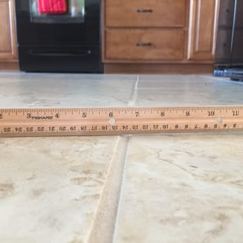 Ha Flooring Services - a ruler on the floor - Flooring Near Me - Taylors, South Carolina Ha Flooring Services - a ruler on the floor - Flooring Near Me - Taylors, South Carolina
