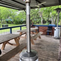 McGinty's BBQ Best Thing Smoking - Porch area. Where you can sit and eat. Also they have heaters out if it's cool out.