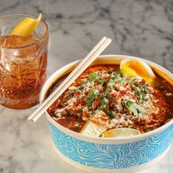 Pignic Pub & Patio - Ramen with a Twist! Birria Beef and Consomme Ramen with a soft boiled egg