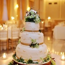 Shawnee Hills Bakery - Three Tier Cake, Chocolate and Vanilla Cake with all Fondant Icing. Live Flowers.