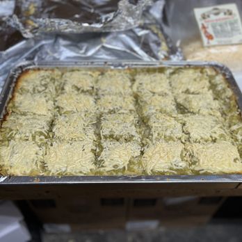 Arandas Mexican Cuisine - Cale Tamal with chilli verde sauce ready for a catering - Mexican Near Me - Barre, Vermont Arandas Mexican Cuisine - Cale Tamal with chilli verde sauce ready for a catering - Mexican Near Me - Barre, Vermont