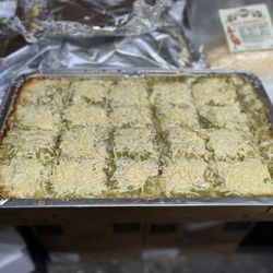 Arandas Mexican Cuisine - Cale Tamal with chilli verde sauce ready for a catering
