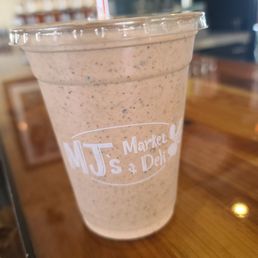 a smoothie in a plastic cup a smoothie in a plastic cup