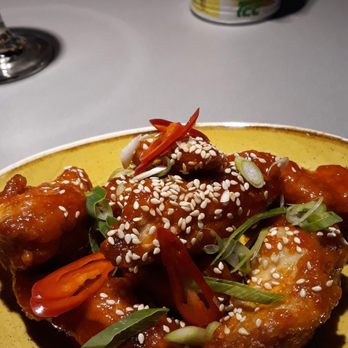 Tampopo - Wings. Plenty hot. But too much for a single person as an appetizer. Add some rice or noodles, and it's a main course. - Asian Fusion Near Me - Manchester, XGM