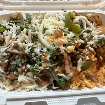 Urbano Burrito - a close up of a container of food - Latin American Near Me - Farmington, New York