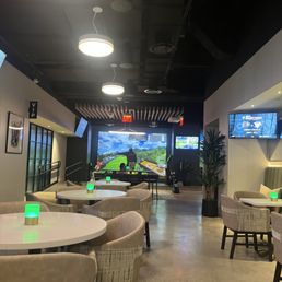 Virtual Golf area in rear overlooking dining area