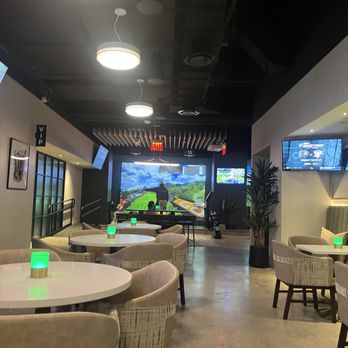 Golfzon Social - Virtual Golf area in rear overlooking dining area - Golf Near Me - Brooklyn, New York