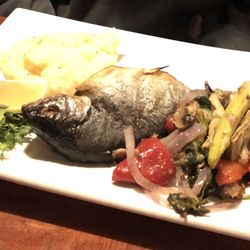 Black Bear Restaurant - Fish w/mashed potatoes & grilled vegetables. The head was a surprise-my college age son didn't care-said the fish itself was delicious.