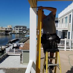 Power Home Inspection - The upper deck supports are not plumb. If not corrected, it could weaken the deck strength and eventually could collapse.