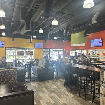Round Table Pizza - Spacious dining area with plenty of tv's all around. - Pizza Near Me - Murrieta, California Round Table Pizza - Spacious dining area with plenty of tv's all around. - Pizza Near Me - Murrieta, California
