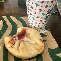 a half eaten pastry and a cup of coffee a half eaten pastry and a cup of coffee