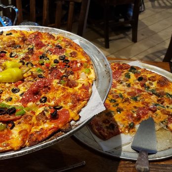 Picasso's - Kitchen sink pizza and sausage and spinach... both were great..homemade sausage was heaven!! - Pizza Near Me - Jacksonville, Florida
