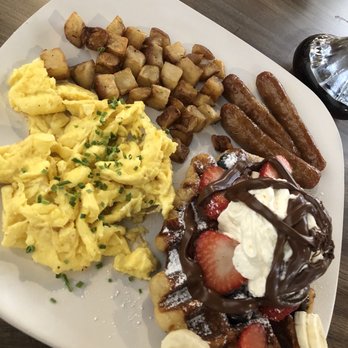 Kaffe Haus - Waffle platter with scrambled eggs, cubed potatoes and sausage. - Breakfast & Brunch Near Me - San Juan, Puerto Rico Kaffe Haus - Waffle platter with scrambled eggs, cubed potatoes and sausage. - Breakfast & Brunch Near Me - San Juan, Puerto Rico