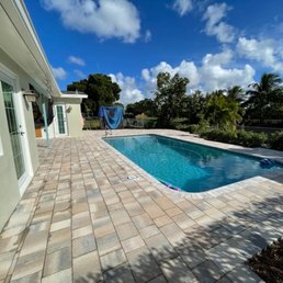 Refinished pool and deck. Does not show the two sets of steps and lower level deck. Note the full size border paver. Refinished pool and deck. Does not show the two sets of steps and lower level deck. Note the full size border paver.