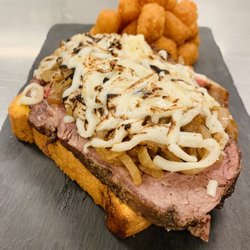 Arrowhead Regional Medical Center Cafeteria - 10 oz prime rib sandwich on toasted brioche, sautéed onions, provolone/mozzarella blend, creamy coarse grain mustard sauce