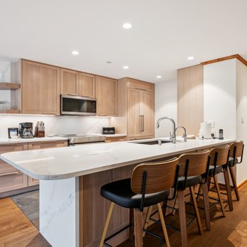 Vail Spa Condominiums - The kitchen with a large island and stools for seating at a condo at Vail Spa Condominiums - Condominiums Near Me - Vail, Colorado Vail Spa Condominiums - The kitchen with a large island and stools for seating at a condo at Vail Spa Condominiums - Condominiums Near Me - Vail, Colorado