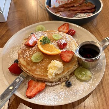 Sunny Side Breakfast - Lemon Ricotta Pancakes with side of bacon. - Breakfast & Brunch Near Me - Sacramento, California Sunny Side Breakfast - Lemon Ricotta Pancakes with side of bacon. - Breakfast & Brunch Near Me - Sacramento, California