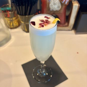 Electric Gravy Mumbai Bar & Canteen - Mumbai 75 (Bombay Dry Gin, rosewater, cardamom, lemon and sparkling wine) - Indian Near Me - Austin, Texas