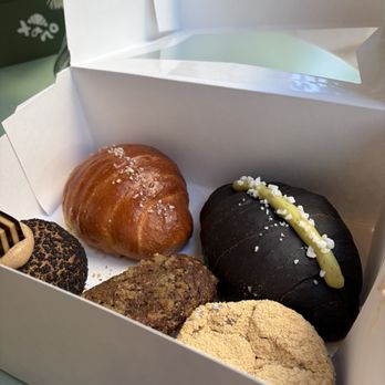 Tano - Right to left:  Top: regular salt bread, Kaya salt bread Bottom: Vietnamese coffee cream puff, earl grey banana bread, Kinako mochi - Bakeries Near Me - San Francisco, California