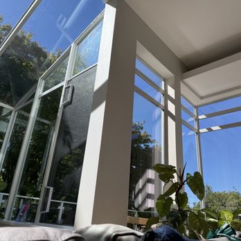 All Season Window Tint - Left side of photo has sunroom with UV protectant, right side windows have none - Auto Glass Services Near Me - Seattle, Washington