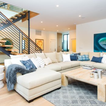 Morpheus Design - a living room with a staircase - Interior Design Near Me - Los Angeles, California Morpheus Design - a living room with a staircase - Interior Design Near Me - Los Angeles, California