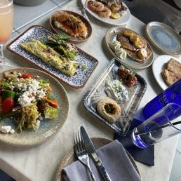 Brunch Menu Items: Greek Garden Salad, Banana Pancakes, Hummus, Veggie Omelette, Shrimp and Grits