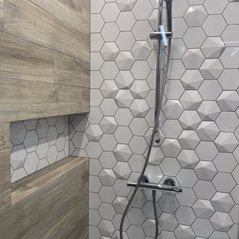 W Development & Services - Light mosaic combined with wood effect tiles in a custom shower made by our contractors. Installed plumbing and glass screen. - General Contractors Near Me W Development & Services - Light mosaic combined with wood effect tiles in a custom shower made by our contractors. Installed plumbing and glass screen. - General Contractors Near Me