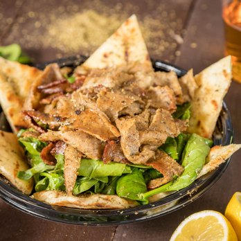 Nick The Greek - a bowl of nachos and a bottle of beer - Mediterranean Near Me - Santa Rosa, California Nick The Greek - a bowl of nachos and a bottle of beer - Mediterranean Near Me - Santa Rosa, California