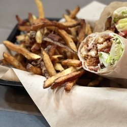The Outpost On The River - Chicken, bacon, ranch wrap with had cut fries
