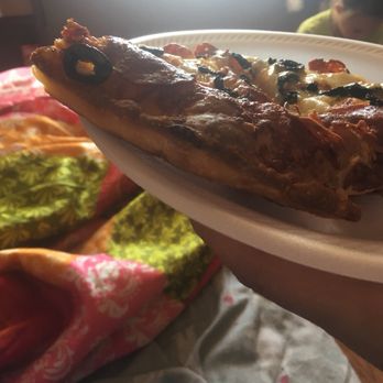 Dominos Pizza - a slice of pizza on a paper plate - Pizza Near Me - Los Banos, California
