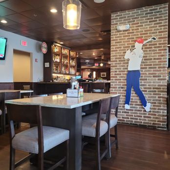 Mulligan's Pub - a man playing golf - Irish Near Me - Ponte Vedra Beach, Florida