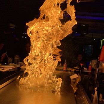 Kobe Steakhouse - a large flame coming out of the grill - Sushi Bars Near Me - Atlanta, Georgia