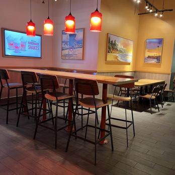 Habit Burger & Grill - a long table with chairs - Burgers Near Me - Anaheim, California Habit Burger & Grill - a long table with chairs - Burgers Near Me - Anaheim, California