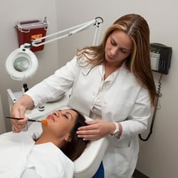 Frank J Scaccia MD - Professional Beauty Aesthetician performing facial treatment,