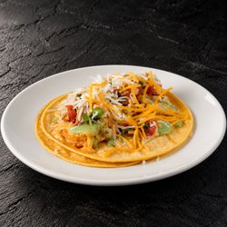 Fuego Cravings - Crispy fried fish topped with creamy chipotle sauce, fresh cabbage, and pico de gallo, all on two warm corn tortillas.