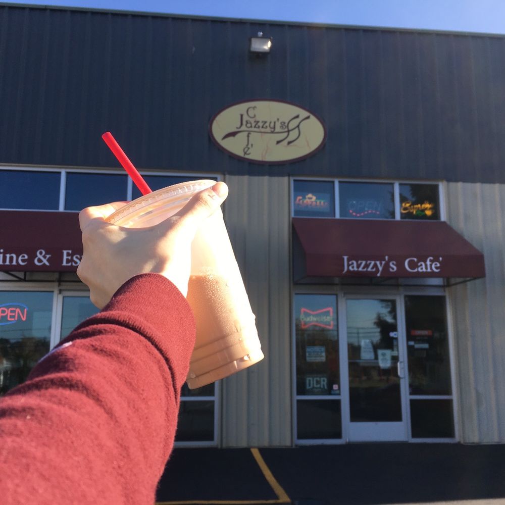 Jazzy's Cafe - a hand holding a drink in front of a building - Cafes Near Me - Tacoma, Washington Jazzy's Cafe - a hand holding a drink in front of a building - Cafes Near Me - Tacoma, Washington