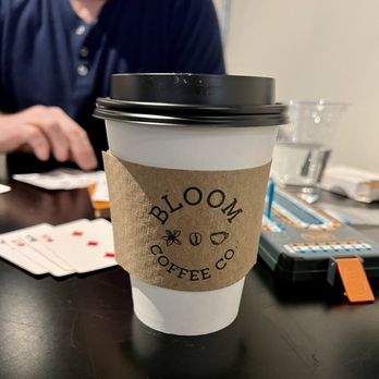 Bloom Coffee - a cup of coffee on a table - Coffee & Tea Near Me - Atlanta, Georgia Bloom Coffee - a cup of coffee on a table - Coffee & Tea Near Me - Atlanta, Georgia